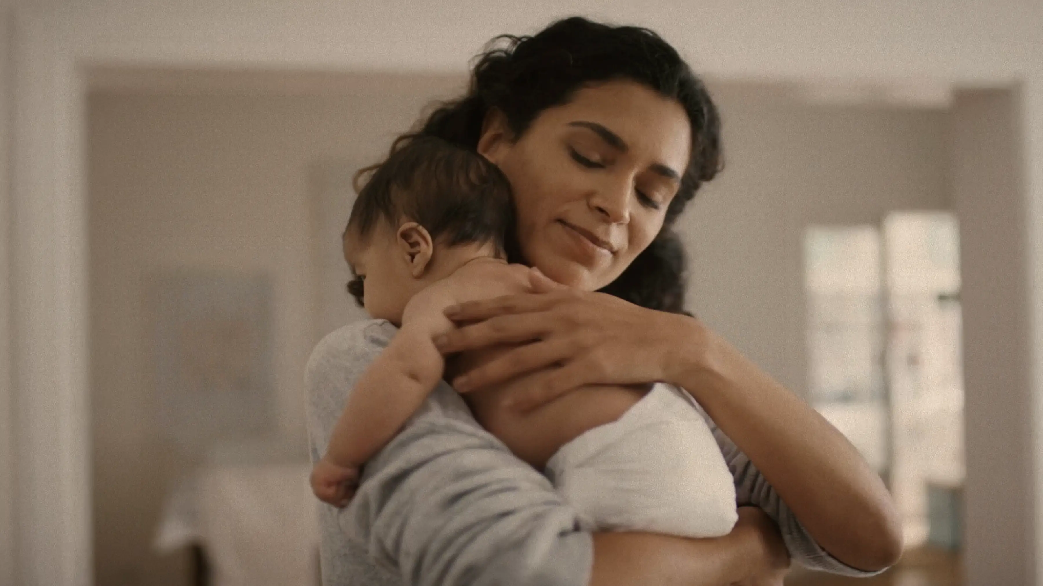 mother holding baby